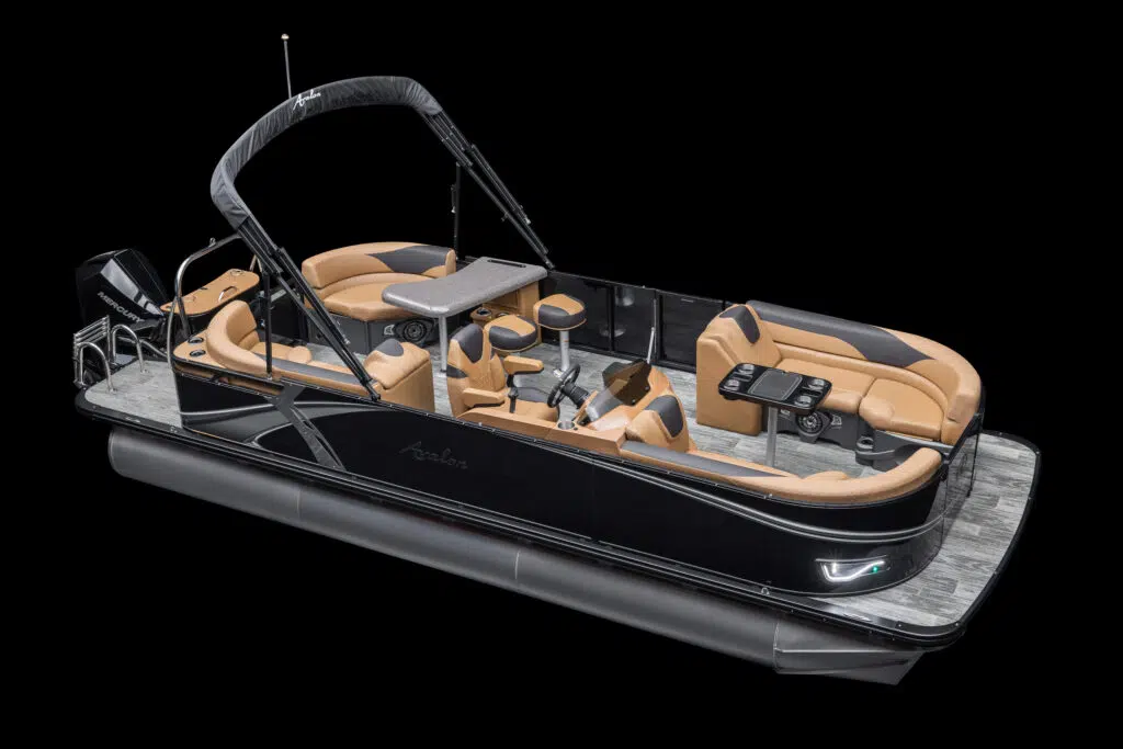 A sleek black pontoon boat with tan leather seating, equipped with several seats, a steering console, cup holders, and a canopy. The boat is designed for leisure, prominently featuring a spacious deck and modern amenities. The boat is set against a plain black background.