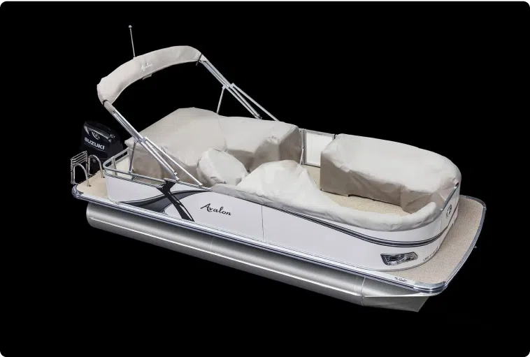 A white pontoon boat with beige covers and a canopy, featuring silver railings and an Avalon brand logo on the side. The boat has cushioned seating areas and a Suzuki outboard motor. Displayed against a solid black background, this model offers luxury at an unbeatable pontoon boat price.