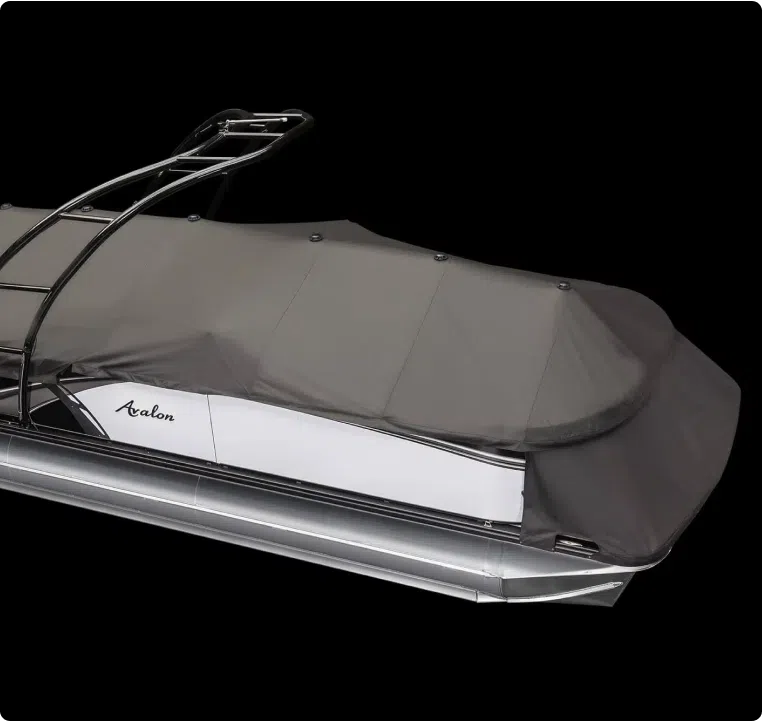 A sleek, covered pontoon boat by Avalon is shown against a solid black background. The boat features a black protective cover, aluminum pontoons, and a portion of its white exterior is visible. The boat's minimalist and modern design is highlighted in this side view, hinting at its premium pontoon boat price.