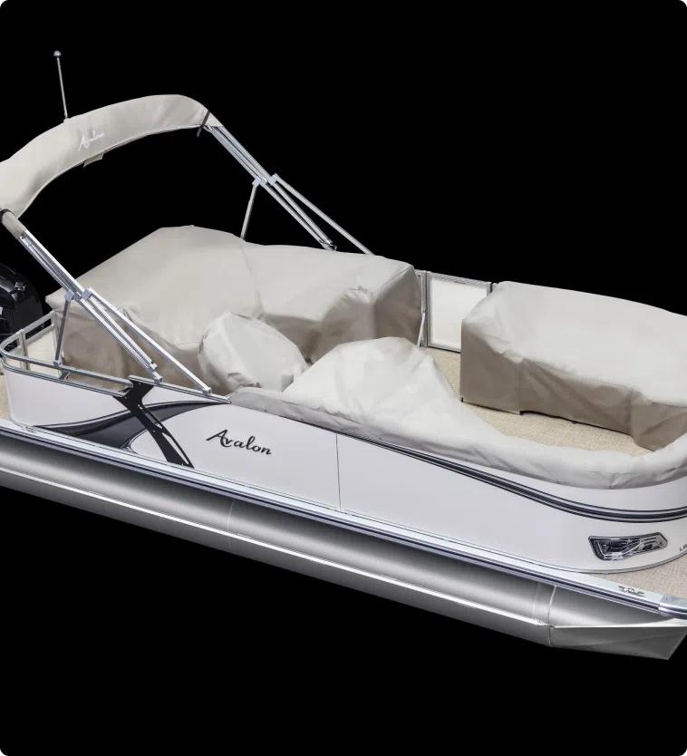 A sleek, silver pontoon boat with a beige canopy and protective covers over the seating areas. The boat, branded "Avalon," boasts a modern design with chrome rails and a spacious deck. Perfect for those interested in new pontoon boat sales, it's set against a plain black background.