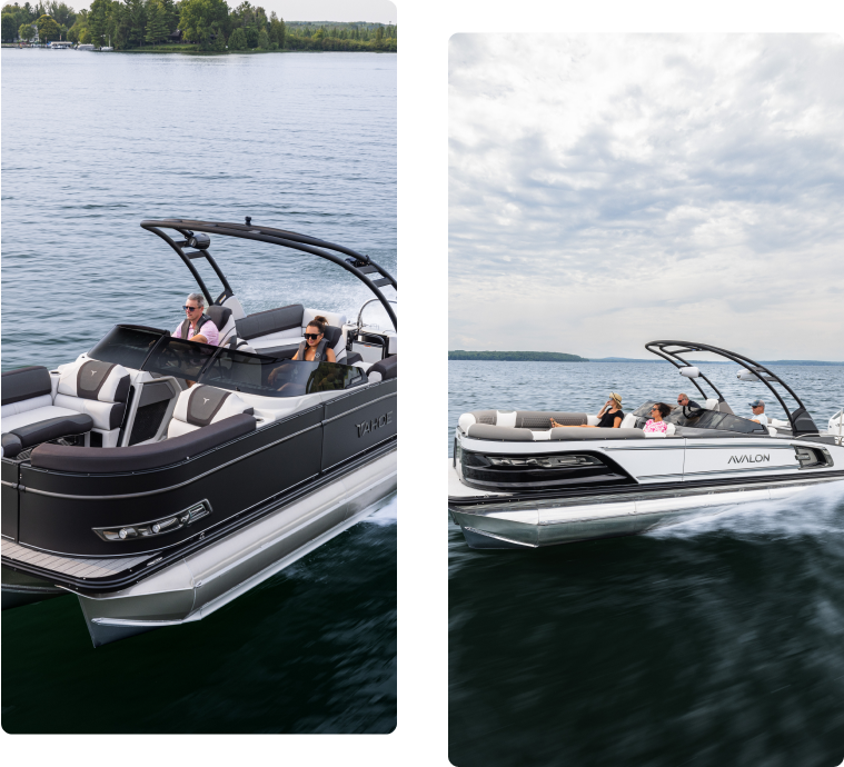 Two pontoon boats cruising on a calm lake. The left boat is dark with two people on board. The right boat is white with four people relaxing. Both boats have sleek designs, and the sky is partly cloudy.