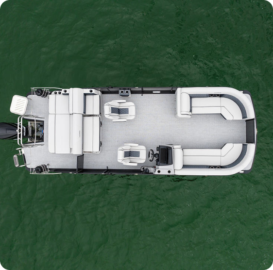 Aerial view of a pontoon boat on the water. The boat has a spacious layout with white seating, including two curved benches at the front, a bench at the back, and two swivel chairs in the center. The water is a deep green.